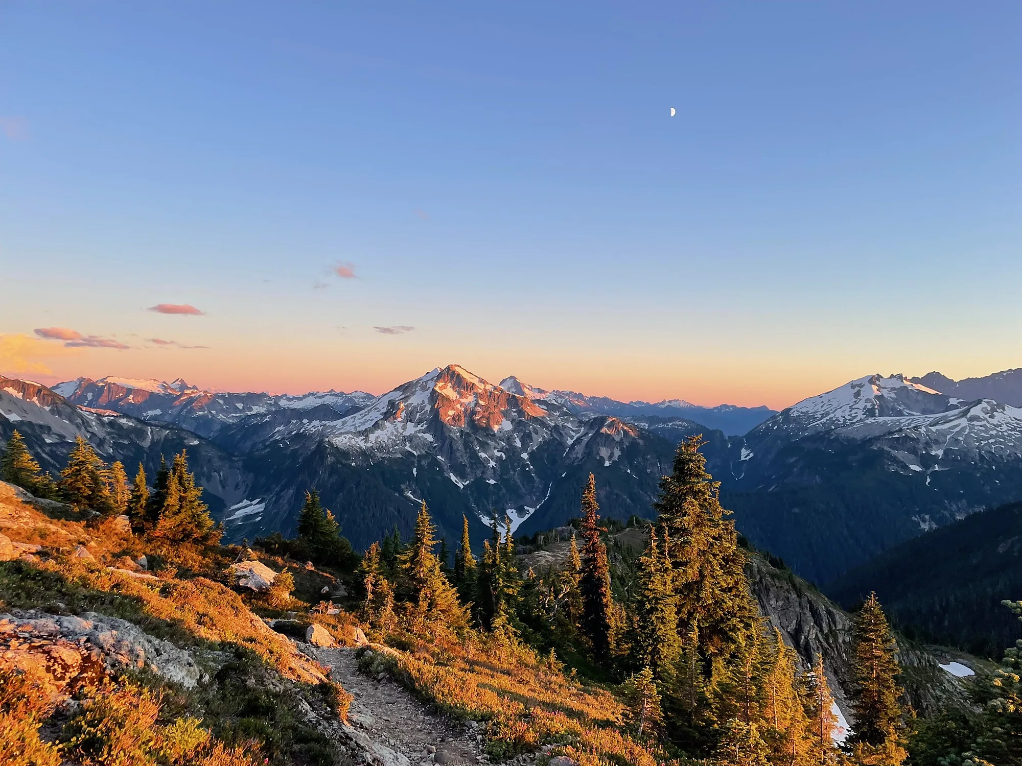 First light on a high ridge, gold autumn slope falling away below it